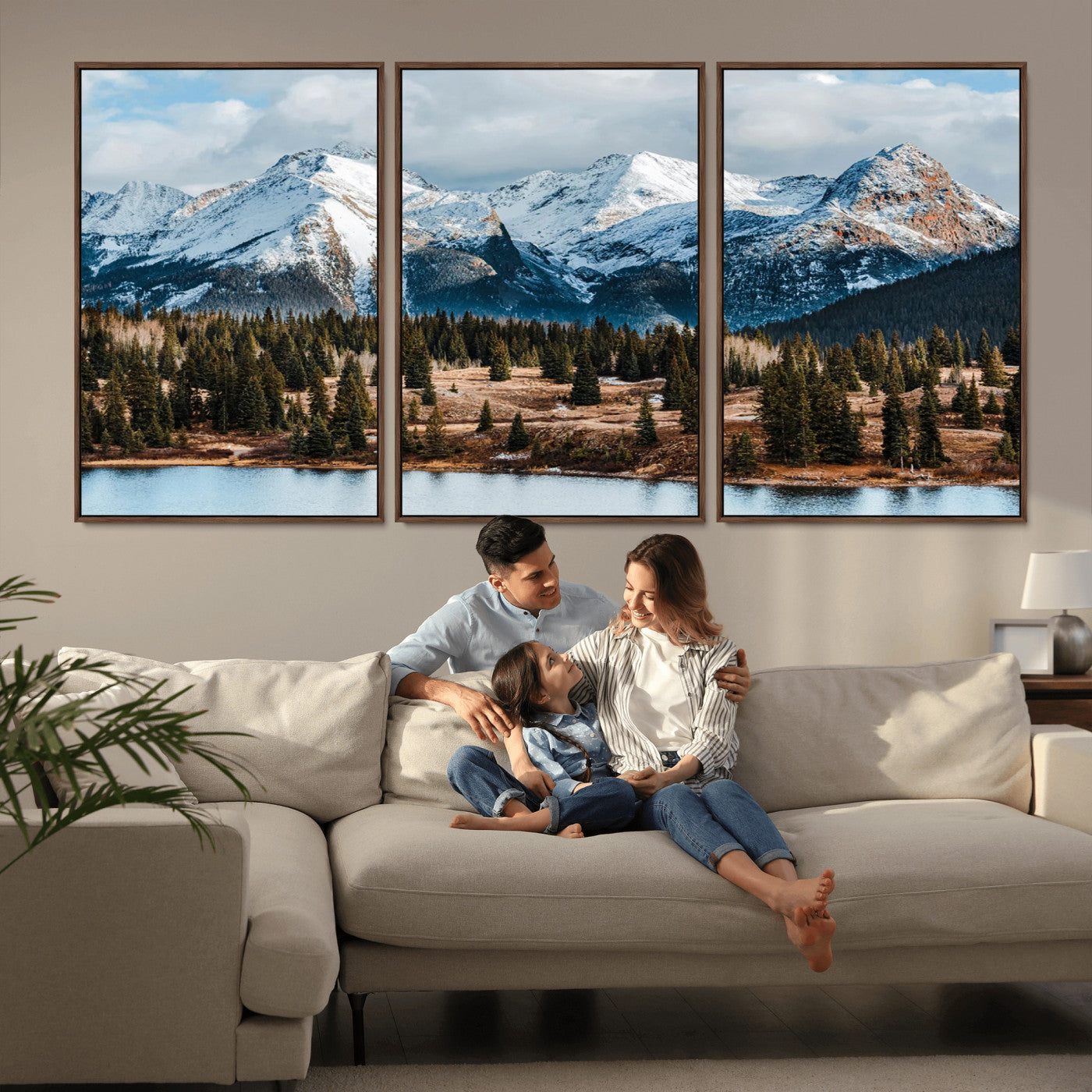 Framed canvas of snowy mountain peaks with pine forest and alpine lake, perfect for winter cabin or wilderness-inspired home decor.