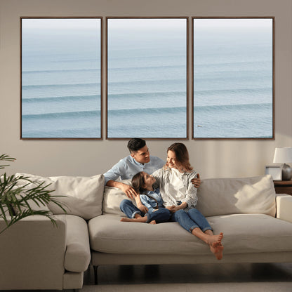 Framed canvas of repeating ocean waves with a distant solo surfer, ideal for minimalist ocean or calm coastal wall decor.
