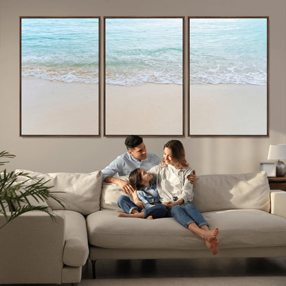Soft shoreline with gentle aqua waves on smooth sand, ideal for minimalist coastal or pastel ocean-inspired home wall decor.