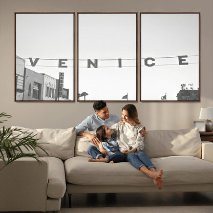 Black and white photo of Venice Beach sign and palm-lined street, perfect for urban coastal or minimalist LA-inspired wall decoration.
