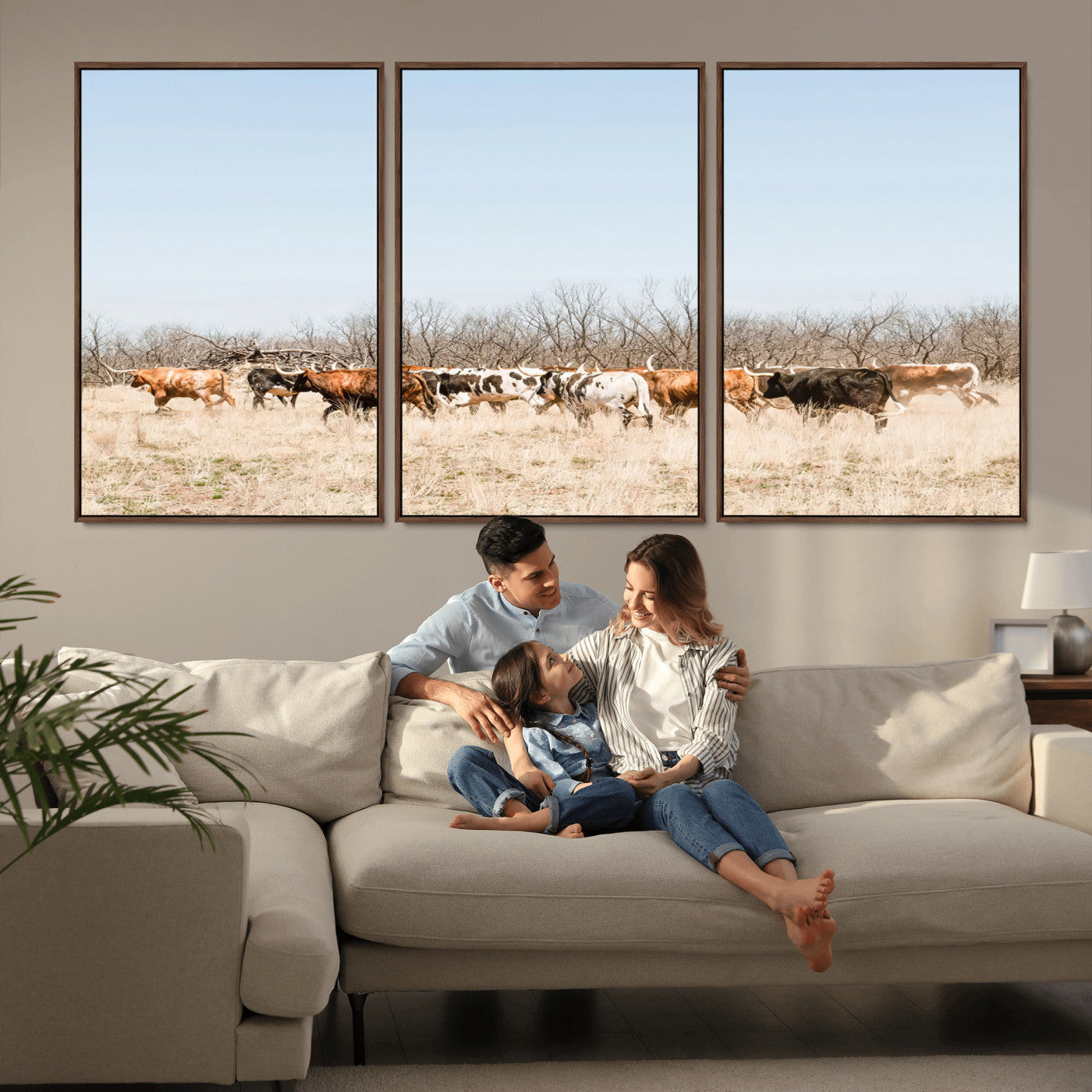 Framed wall art of Texas longhorn cattle walking through a dry, neutral-toned prairie, perfect for rustic farmhouse or western-themed home decor.