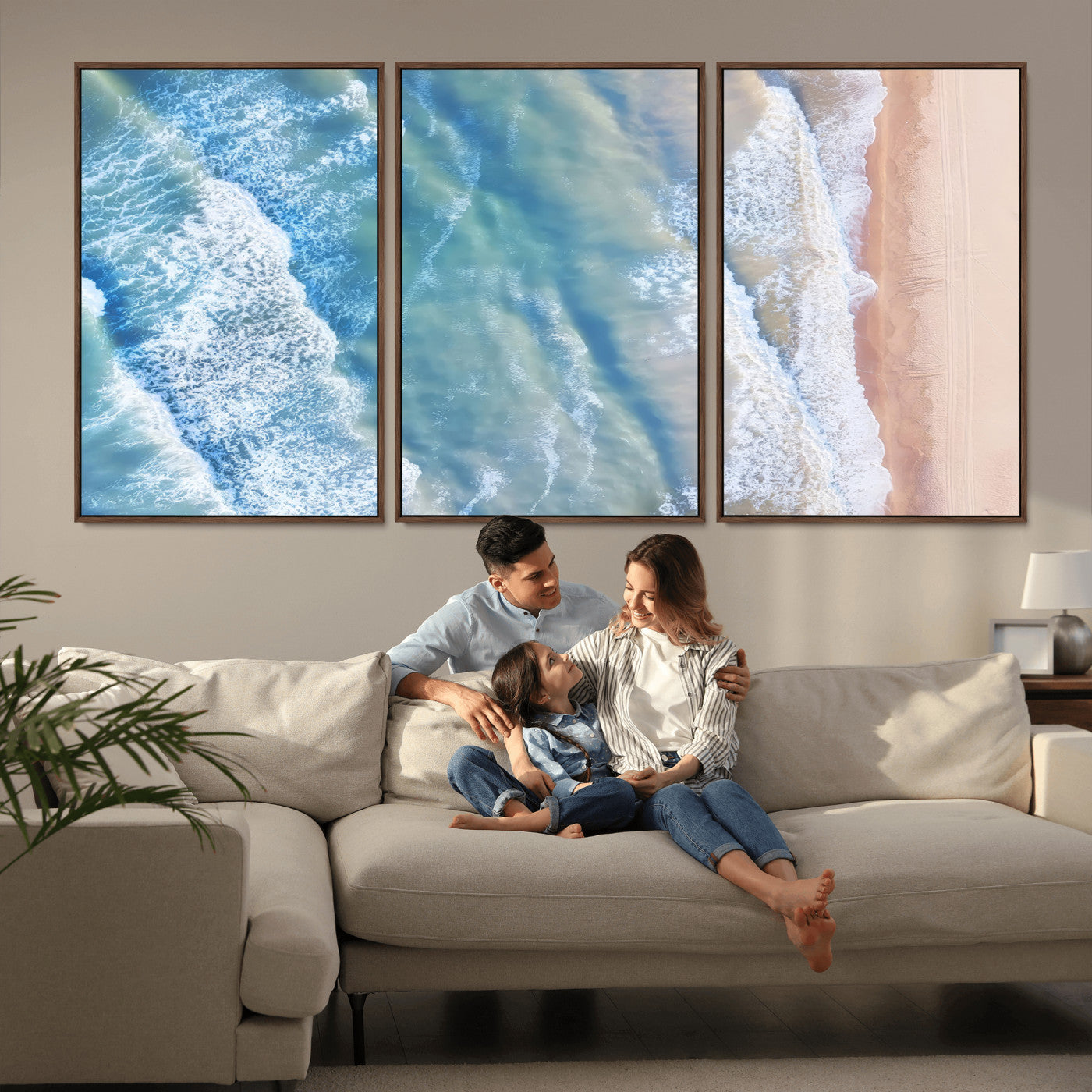 Aerial photo of soft blue waves meeting sandy shore, perfect for modern coastal or beach-themed decor with a light and tranquil aesthetic.