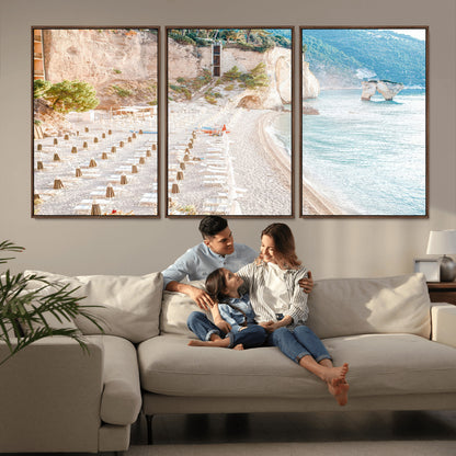 Wall art of a calm Mediterranean beach with rows of sun loungers and umbrellas in soft pastel tones, perfect for light coastal or vacation-themed decor.