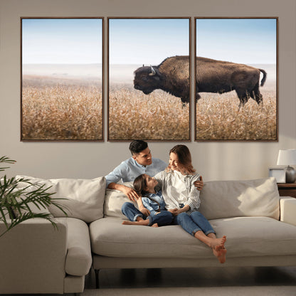A majestic bison standing in an open prairie field, its strong form blending into the golden grass under a vast blue sky, evoking the wild spirit of the American plains.