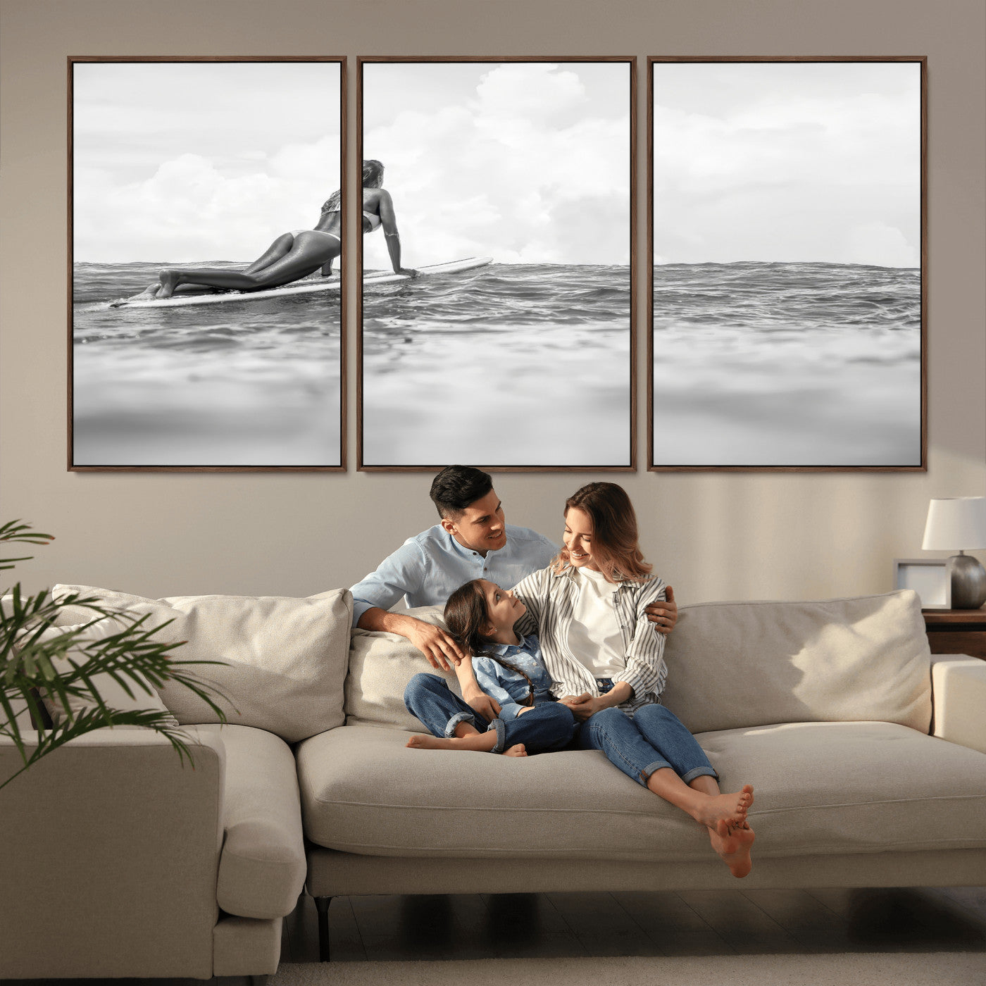 A black and white ocean scene featuring a surfer girl waiting on her board, gazing at the horizon, capturing a tranquil and adventurous coastal moment.