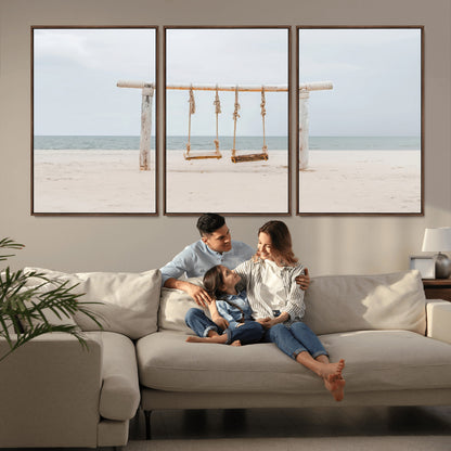 A rustic wooden beach swing stands on a serene sandy shore with an ocean horizon in the background, creating a tranquil and dreamy coastal escape.
