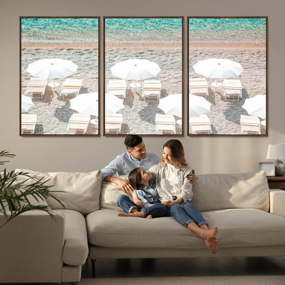 A bright beach scene with white umbrellas, pastel sand, and turquoise waters, creating a tranquil coastal vibe, perfect for beach house or summer decor.