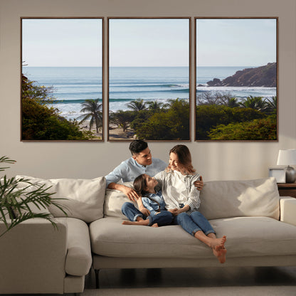 View of calm ocean waves with palm trees and a tropical coastline, ideal for coastal boho or beach-themed wall decor.