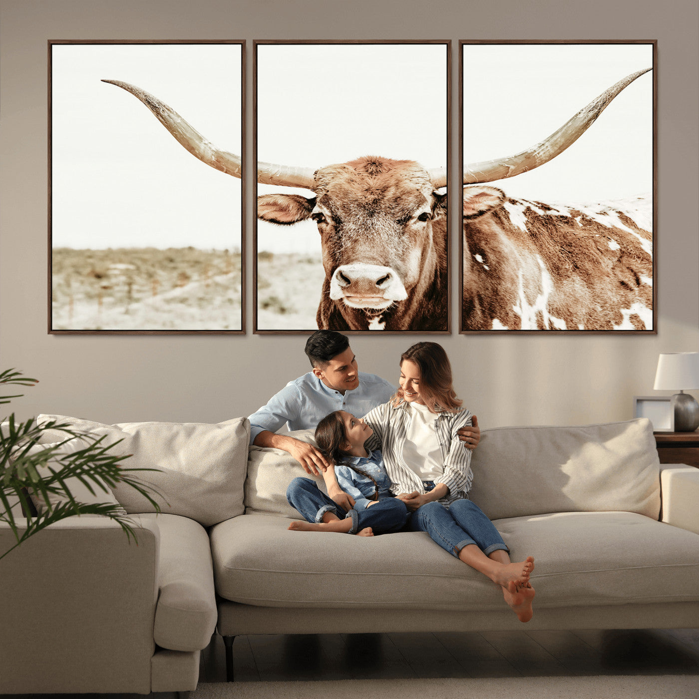 A Texas longhorn bull with wide horns, standing in a dry field under soft light, ideal for rustic farmhouse or western-themed interiors.