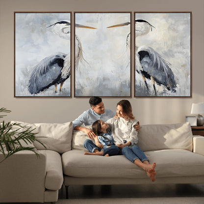 Two herons facing each other on a soft-toned background with blue-grey feathers, perfect for tranquil, coastal or nature-themed interiors.