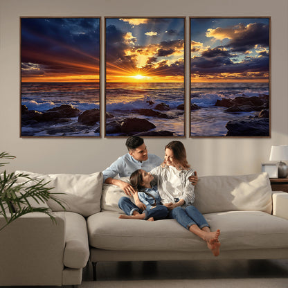 An explosive sunset over the ocean with dramatic clouds and rays of sunlight reflecting off the water, creating a vibrant and captivating view.