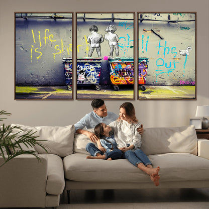 Graffiti-style canvas art with bold text and two naked figures over urban dumpsters, ideal for edgy or street-style decor.