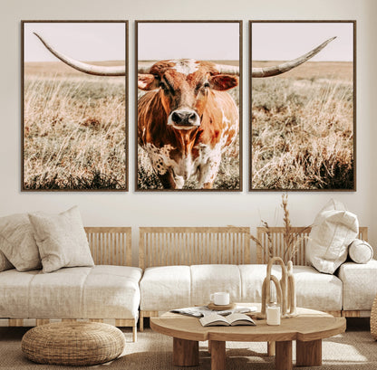 Framed longhorn cow canvas wall art with rustic prairie background, western animal print perfect for farmhouse or ranch style decor