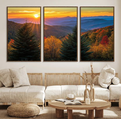 Vibrant sunset over autumn mountains with colorful trees and warm light, ideal for nature lovers or cabin-style wall decor.