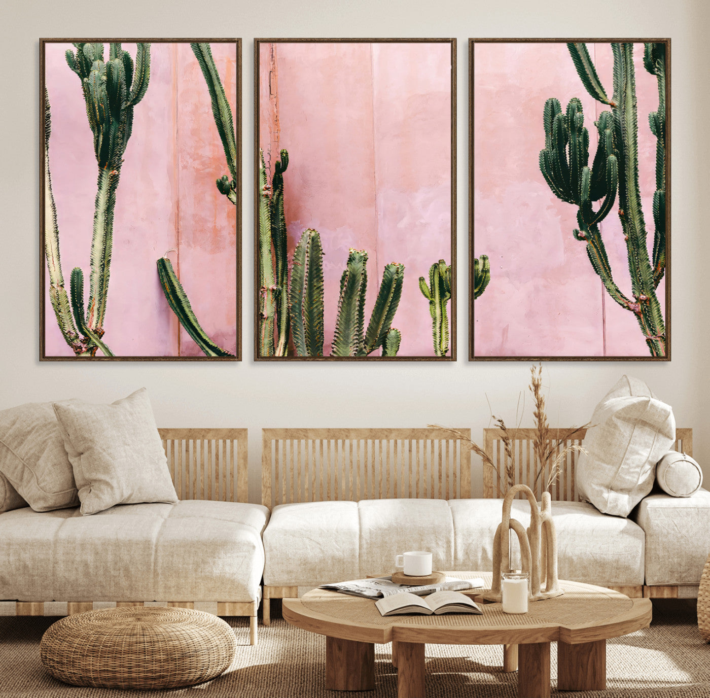 Framed canvas of tall green cacti against a soft pink wall, ideal for modern desert or colorful southwest-inspired home decor.