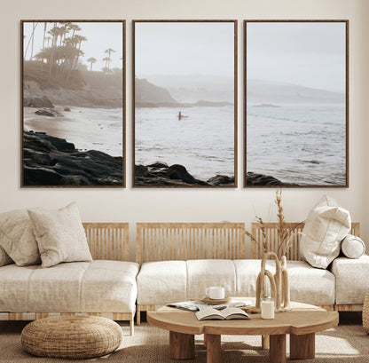 Framed canvas of a surfer in misty coastal tones at a foggy California beach, ideal for minimalist coastal beach or serene ocean-themed decor.