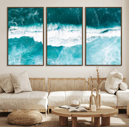 Aerial view of turquoise ocean waves crashing with white foam, perfect for tropical coastal or modern beach-style home decor.