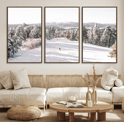 Bright ski trail lined with snow-covered pines and a skier in orange, perfect for alpine adventure or winter sports-inspired decor.