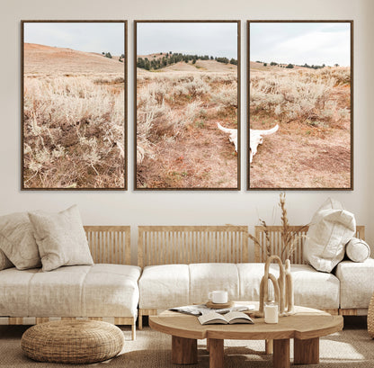 Rustic bull skull on dry sagebrush field under soft light, ideal for western minimal or desert prairie-style wall decoration.