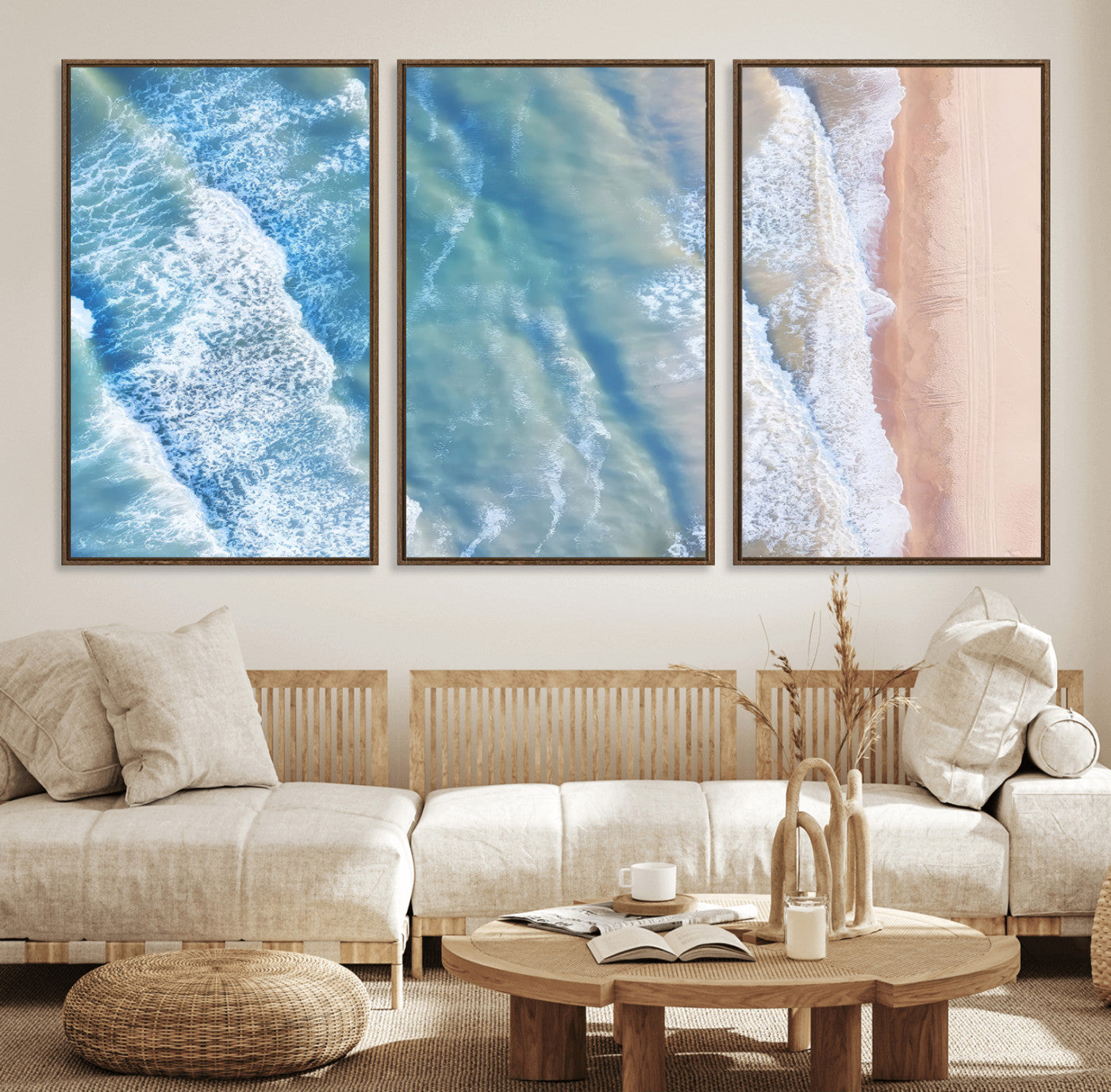 Aerial photo of soft blue waves meeting sandy shore, perfect for modern coastal or beach-themed decor with a light and tranquil aesthetic.