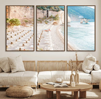 Wall art of a calm Mediterranean beach with rows of sun loungers and umbrellas in soft pastel tones, perfect for light coastal or vacation-themed decor.