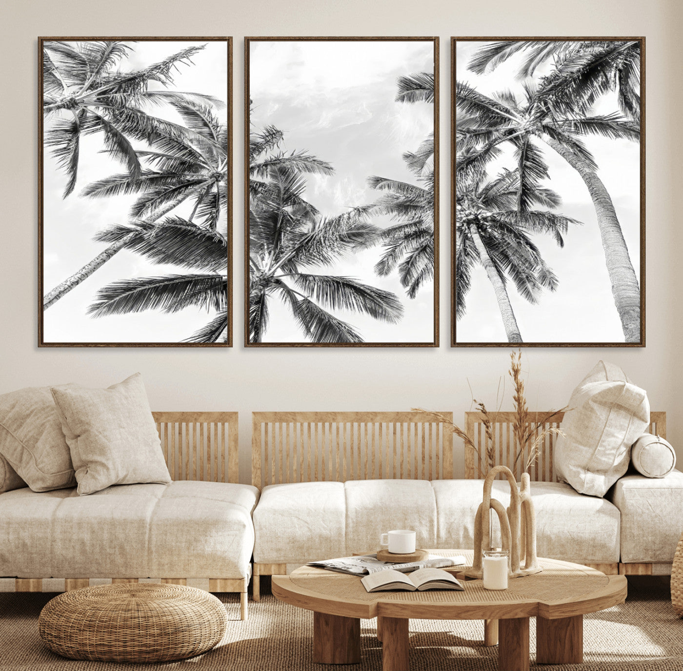 Black and white tropical palm trees viewed from below, swaying gently against a bright sky, creating a serene and elegant coastal atmosphere.