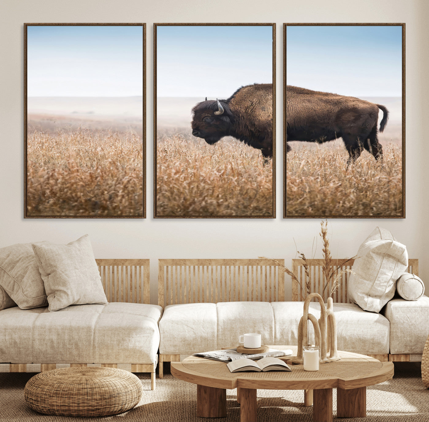 A majestic bison standing in an open prairie field, its strong form blending into the golden grass under a vast blue sky, evoking the wild spirit of the American plains.