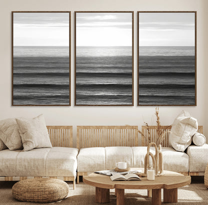 Minimalist black and white ocean view with layered waves reflecting sunlight, evoking a sense of calm and coastal serenity.