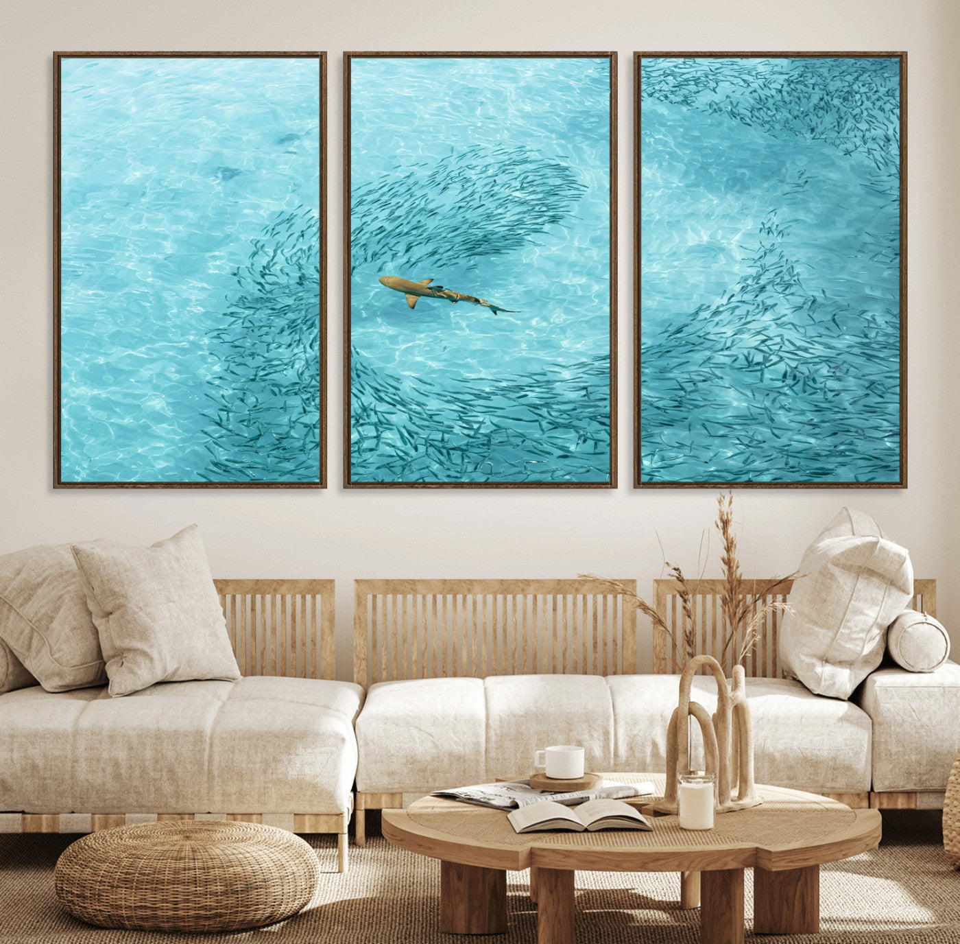 Aerial view of a shark swimming through a swirl of fish in clear turquoise waters, perfect for calm coastal or beach house decor.
