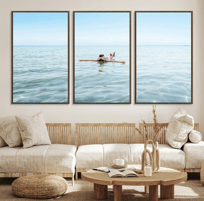 A peaceful minimalist scene of a person floating on crystal-clear water, surrounded by a vast open horizon, capturing relaxation and serenity in a tranquil aquatic setting.
