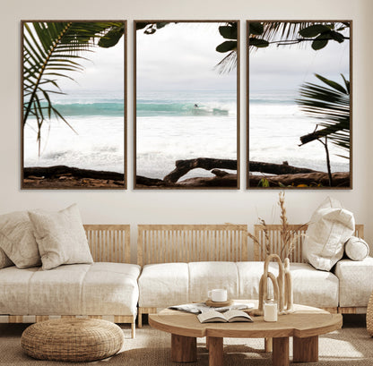 Tropical beach view with palm trees and surfer riding a wave, perfect for boho or coastal-inspired interior wall decor.