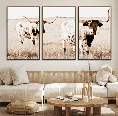 Two Texas longhorn cows standing in a sepia-toned pasture, evoking rustic charm perfect for farmhouse or western country interiors. (
