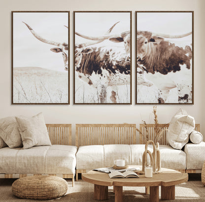 Two longhorn cows standing in a sepia-toned pasture with soft light, ideal for rustic or farmhouse-themed neutral wall decor.