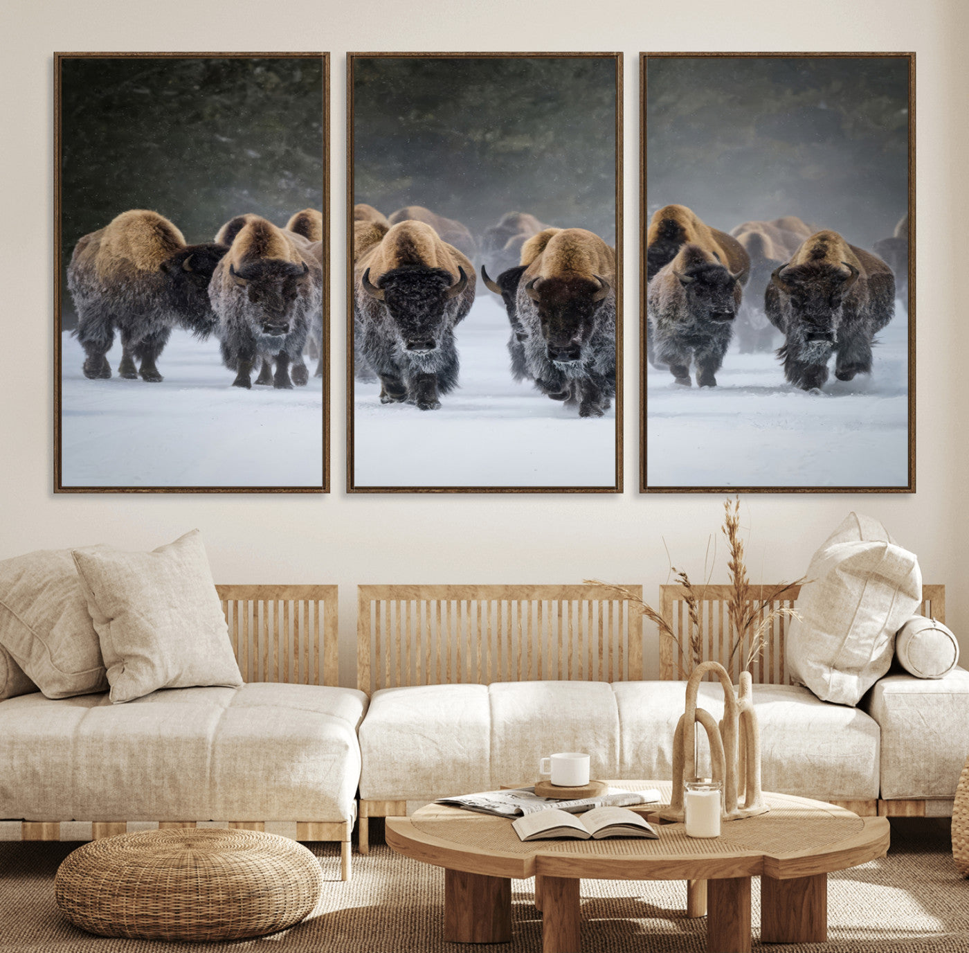 A herd of American bisons walking through deep snow in a forest, evoking a powerful rustic wilderness mood for western-style interiors.