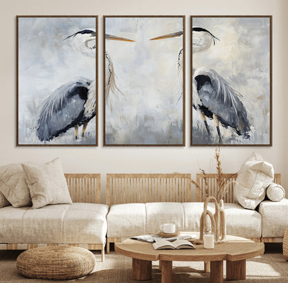 Two herons facing each other on a soft-toned background with blue-grey feathers, perfect for tranquil, coastal or nature-themed interiors.
