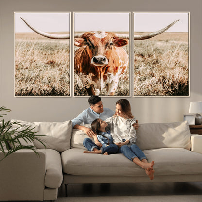 Framed longhorn cow canvas wall art with rustic prairie background, western animal print perfect for farmhouse or ranch style decor