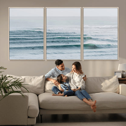 High-angle view of surfers lining up across layered ocean waves, ideal for minimal coastal or surf-inspired room decor.