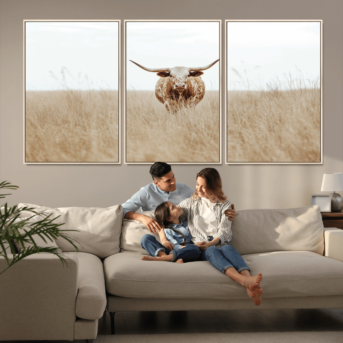 Texas Longhorn bull standing alone in dry grass with neutral tones, ideal for rustic western or cowboy-themed wall decor.