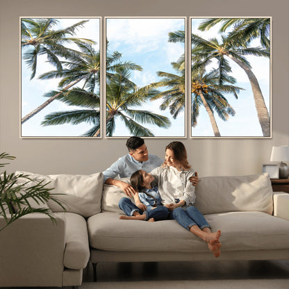 Framed canvas of tall palm trees reaching into a tropical sky, ideal for beach home or relaxed island-inspired wall decor.