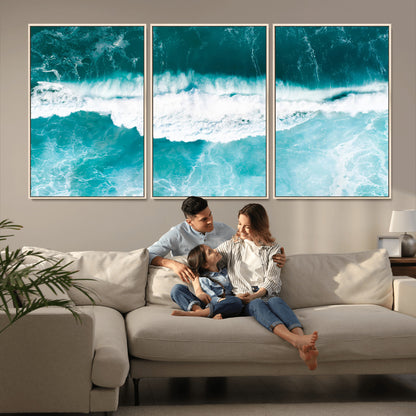 Aerial view of turquoise ocean waves crashing with white foam, perfect for tropical coastal or modern beach-style home decor.
