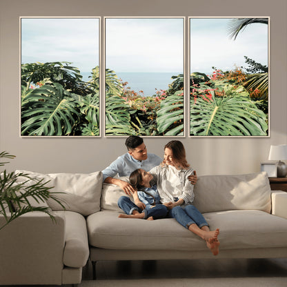 Monstera leaves and tropical flowers framing a calm ocean view, ideal for tropical coastal or exotic jungle-style interior wall decor.
