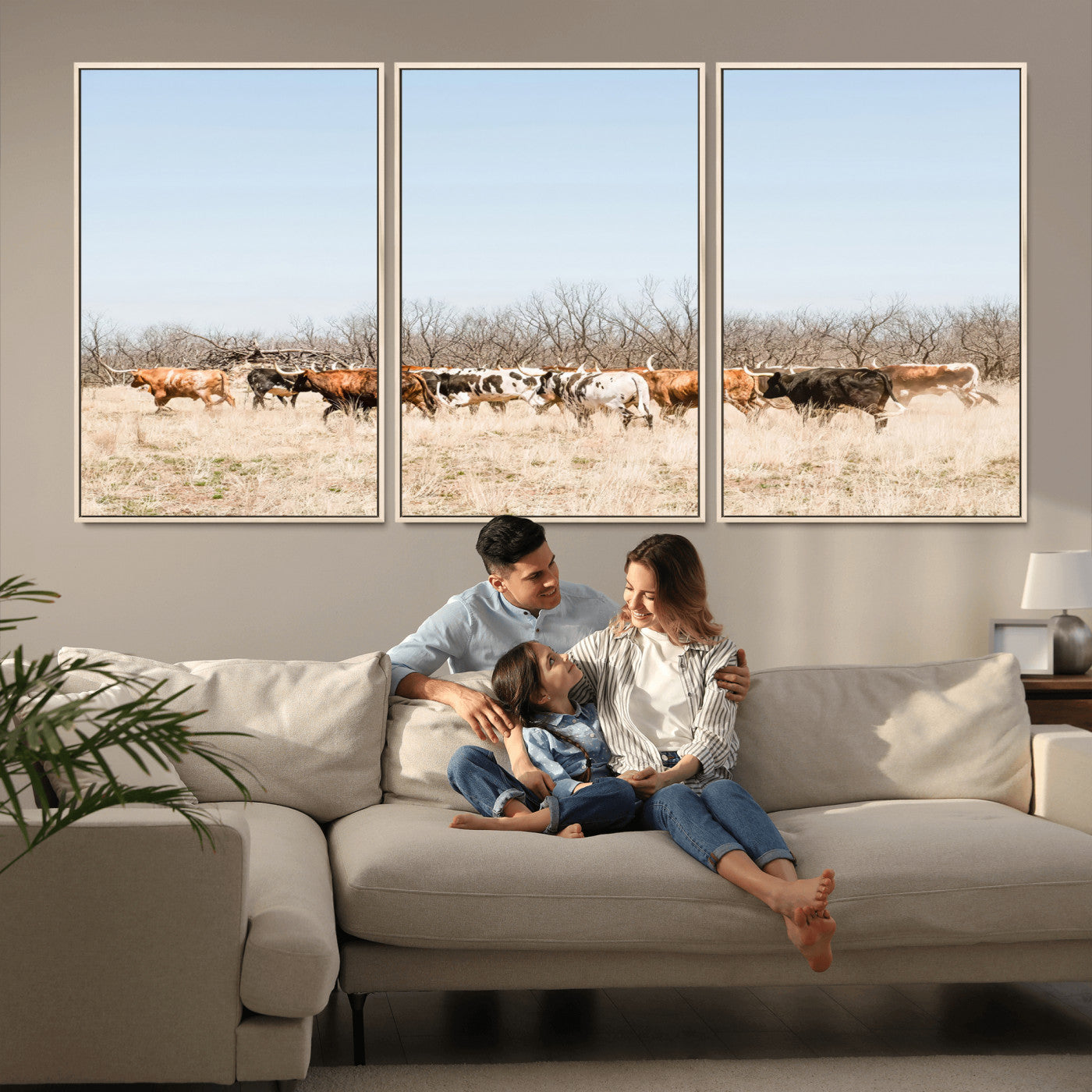 Framed wall art of Texas longhorn cattle walking through a dry, neutral-toned prairie, perfect for rustic farmhouse or western-themed home decor.