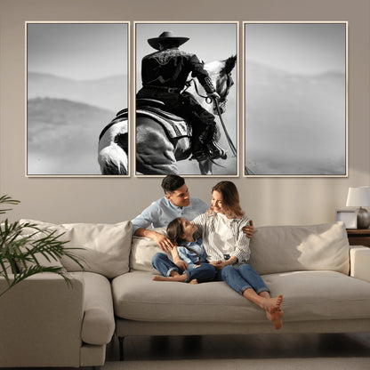 Black and white canvas of a cowboy on horseback with moody tones, perfect for rustic western or country-inspired home decor.