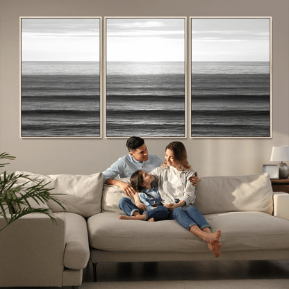 Minimalist black and white ocean view with layered waves reflecting sunlight, evoking a sense of calm and coastal serenity.