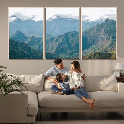 A misty mountain landscape with cloud-covered Andean peaks and lush green valleys, creating a dramatic and serene view, perfect for rustic or nature-inspired home decor.
