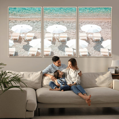 A bright beach scene with white umbrellas, pastel sand, and turquoise waters, creating a tranquil coastal vibe, perfect for beach house or summer decor.