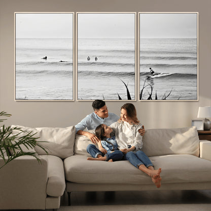 Monochrome canvas of surfers on calm ocean waves, ideal for minimalist coastal or beach-inspired interior decor.