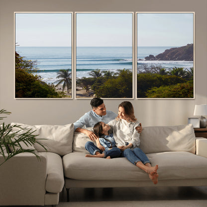 View of calm ocean waves with palm trees and a tropical coastline, ideal for coastal boho or beach-themed wall decor.