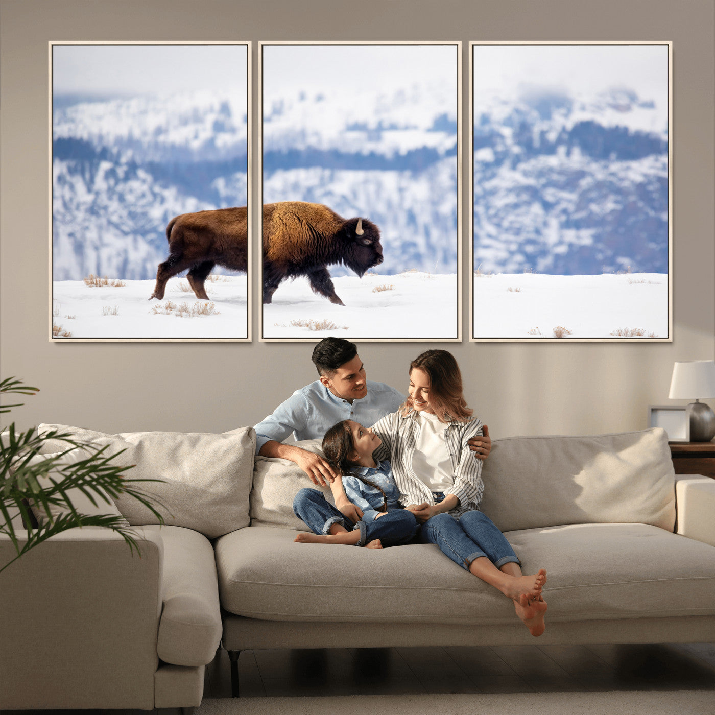 A lone bison walks across snowy ground with blue-toned mountain range behind, ideal for rustic or western farmhouse interiors.