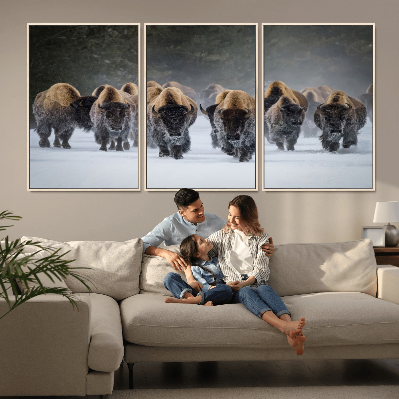 A herd of American bisons walking through deep snow in a forest, evoking a powerful rustic wilderness mood for western-style interiors.